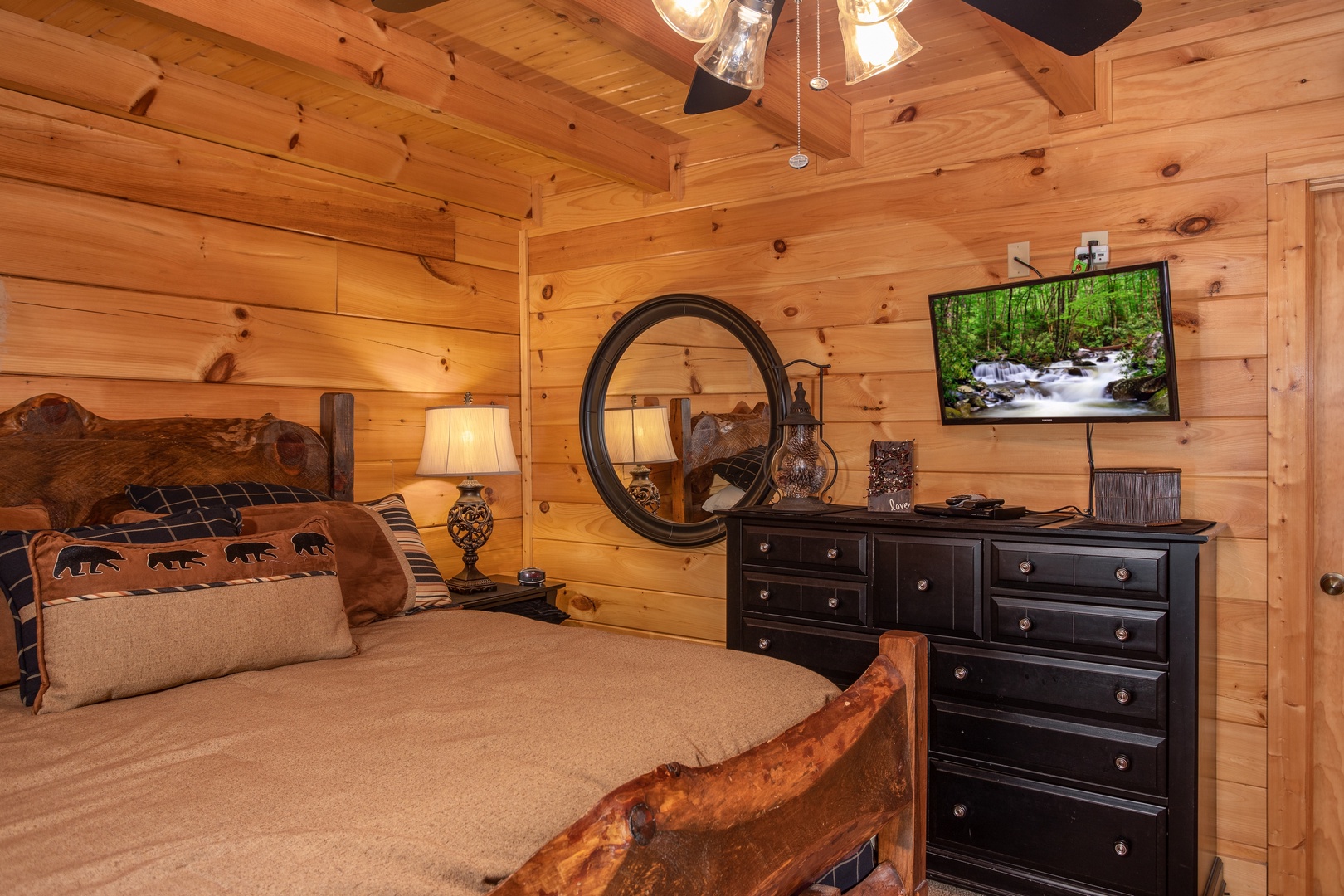 Second bedroom with dresser and television at Bears Eye View, a 2-bedroom cabin rental located in Pigeon Forge