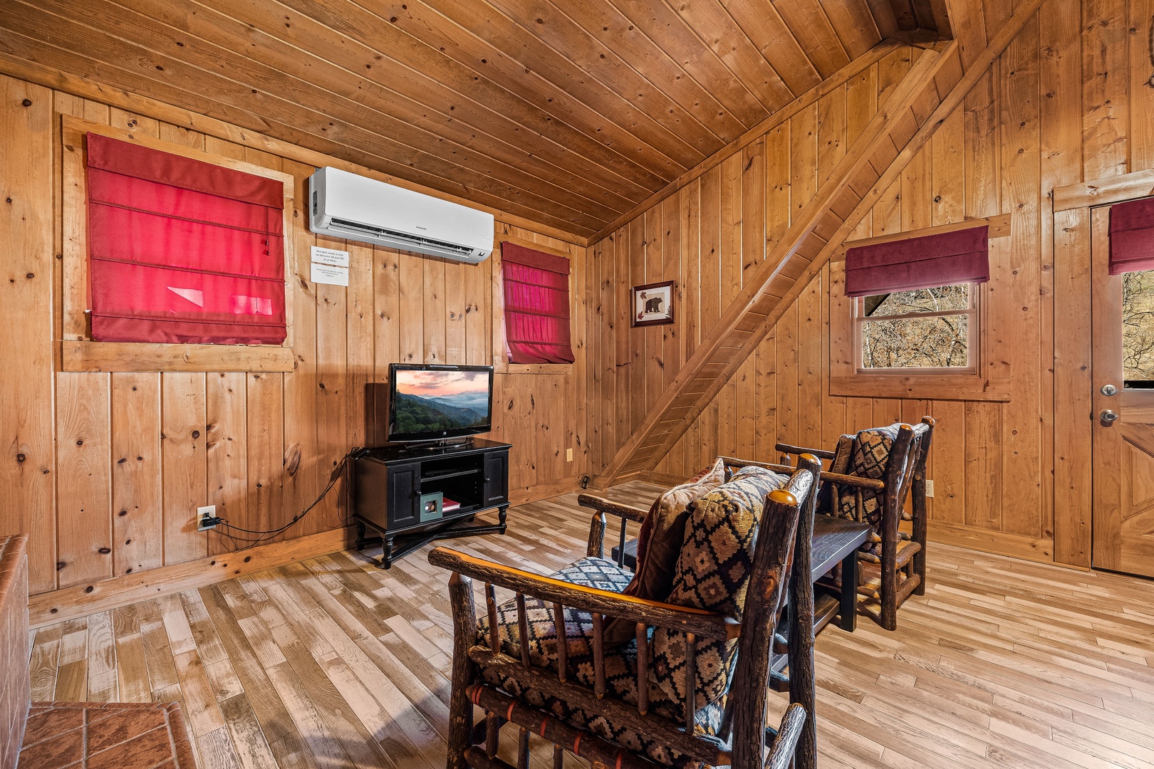Seating area with TV at A Beary Nice Cabin, a 2 bedroom cabin rental located in Pigeon Forge