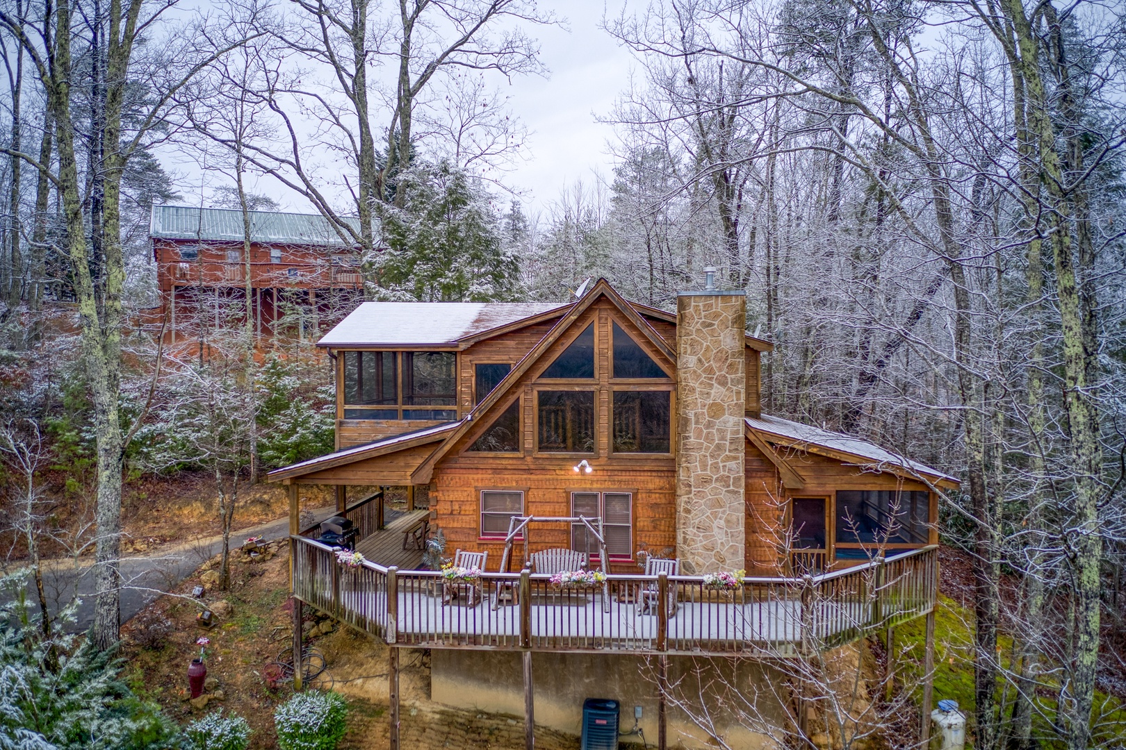 Looking back at Alpine Romance, a 2 bedroom cabin rental located in Pigeon Forge with a dusting of snow