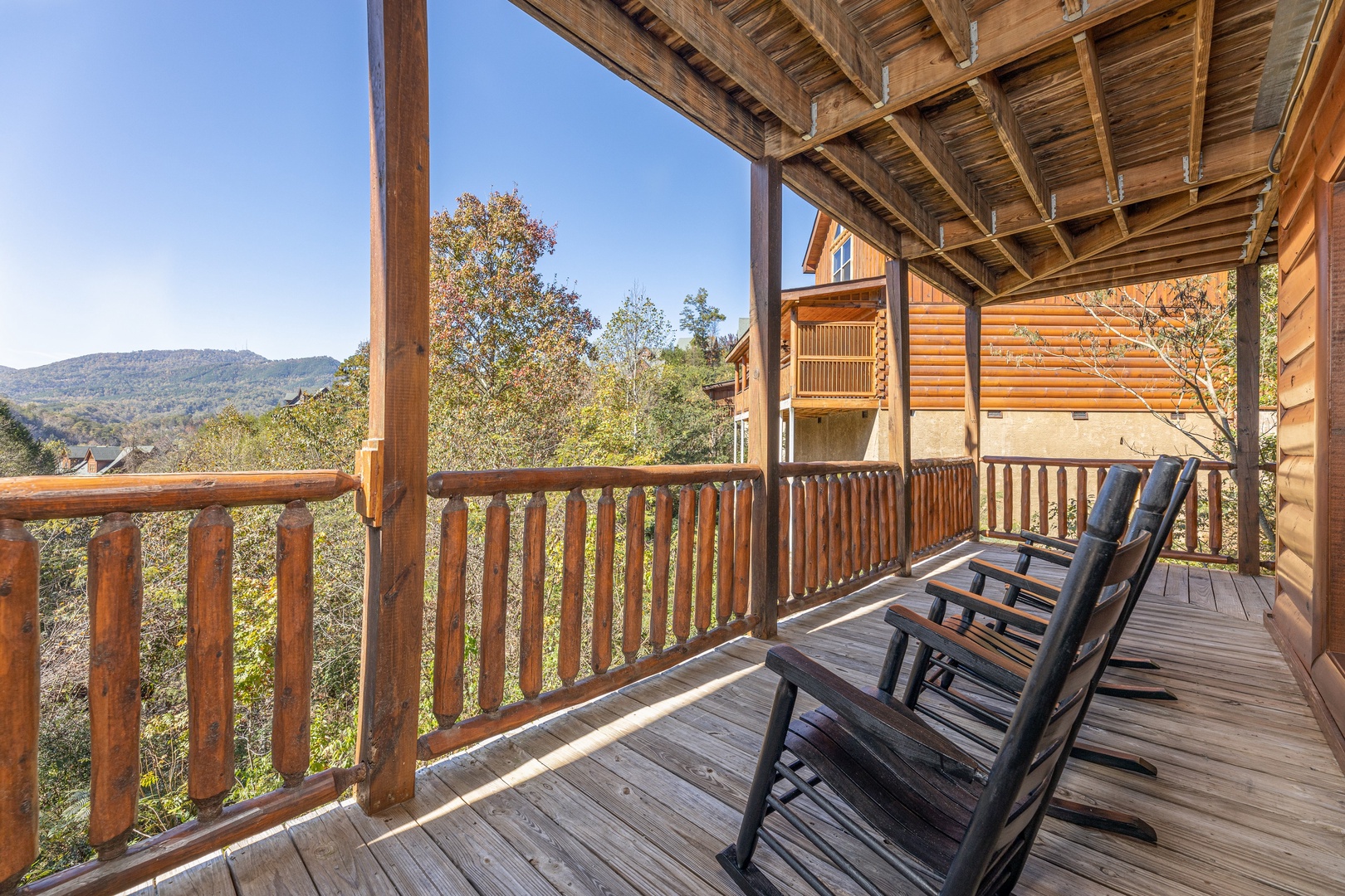 Rocking chairs on a deck at Bears Don't Bluff, a 3 bedroom cabin rental located in Pigeon Forge