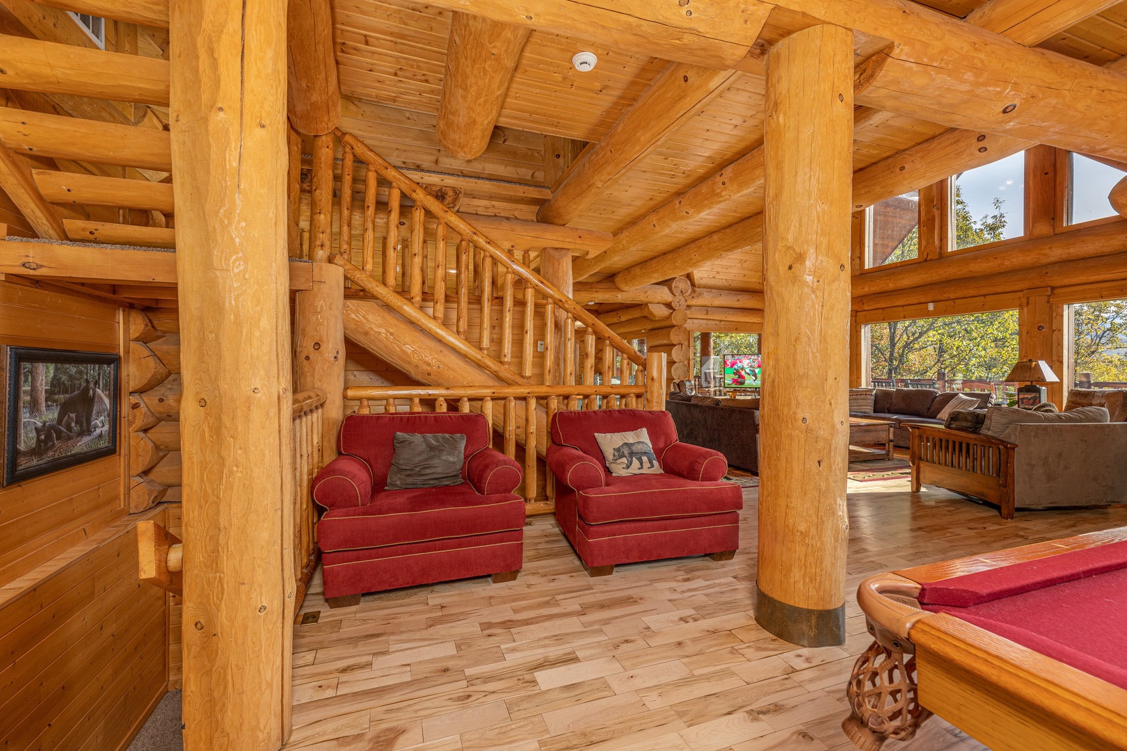 Two large red chairs at Grizzly's Den, a 5 bedroom cabin rental located in Gatlinburg
