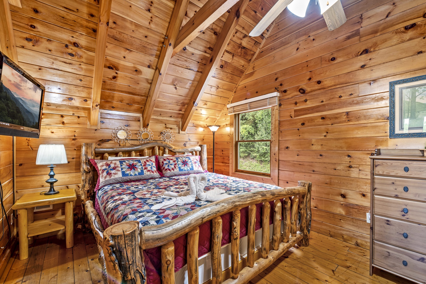 Upstairs bedroom with log furniture at Bear Sunrise