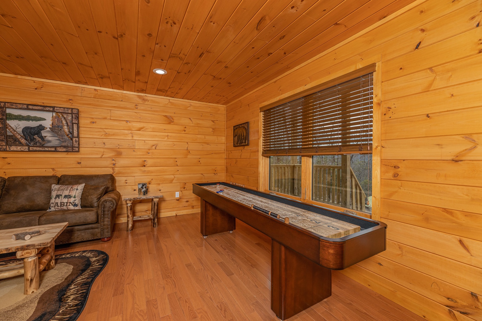 Shuffleboard game at J's Hideaway, a 4 bedroom cabin rental located in Pigeon Forge