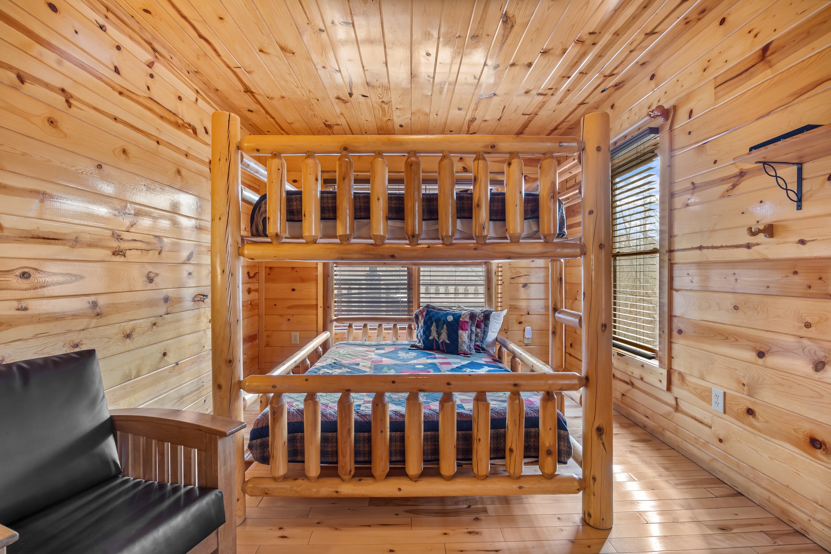 First floor queen bunk beds at Natural Wonder, a 4 bedroom cabin rental located in Gatlinburg