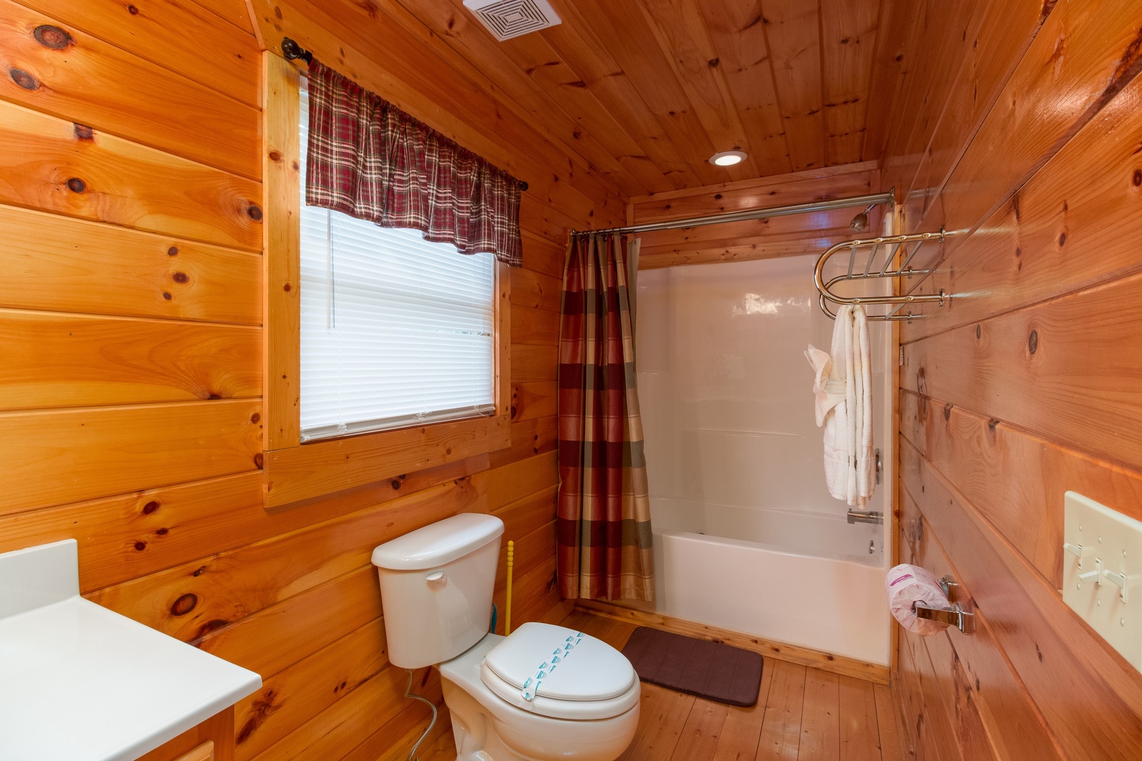 Bathroom with a tub and shower at A Beautiful Memory, a 4 bedroom cabin rental located in Pigeon Forge