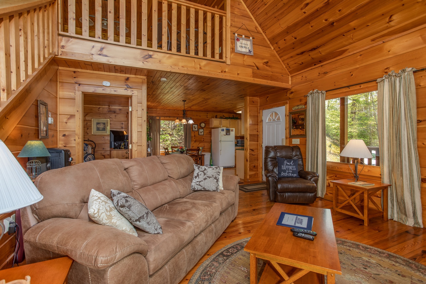 Living room and kitchen at Hillside Haven, a 1 bedroom cabin rental located in Pigeon Forge