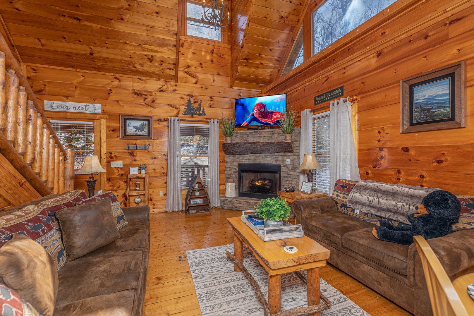 TV and fireplace in the living room at Honey Bear Haven, a 1 bedroom cabin rental located in Pigeon Forge