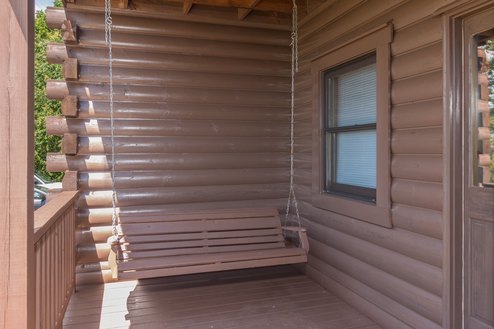 Porch swing at Moose Lodge, a 4 bedroom cabin rental located in Sevierville