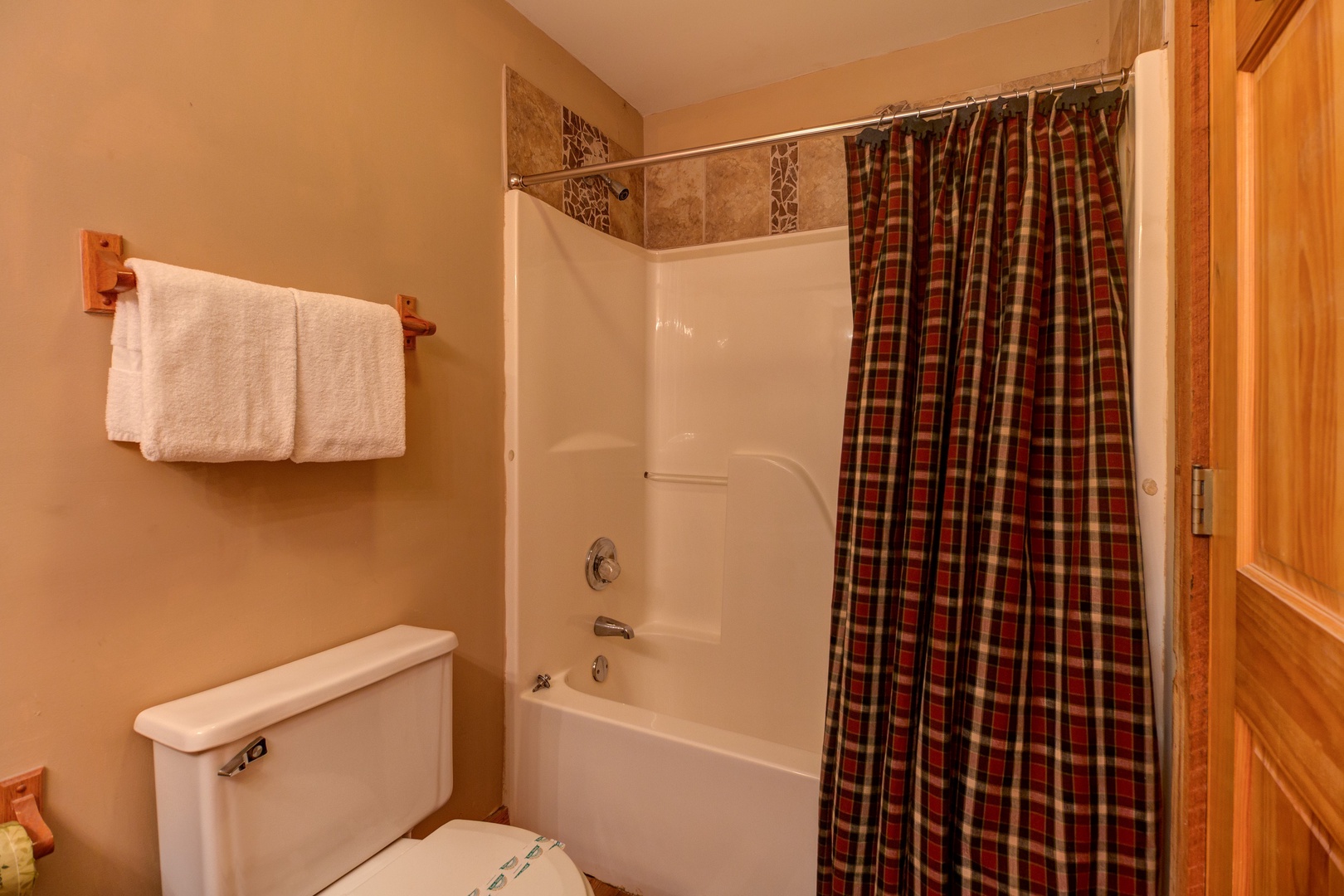 Bathroom with a tub and shower at Just for Fun, a 4 bedroom cabin rental located in Pigeon Forge