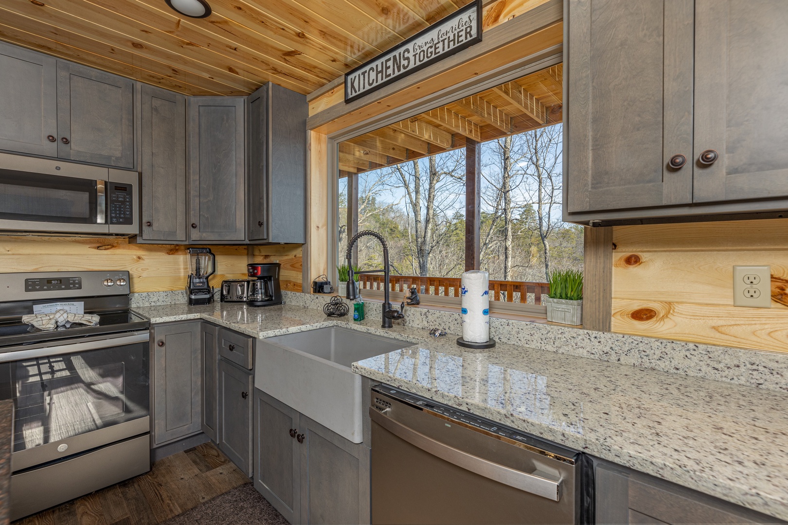 Kitchen with granite counters and a great window at Everly's Splash, a 4 bedroom cabin rental located in Pigeon Forge