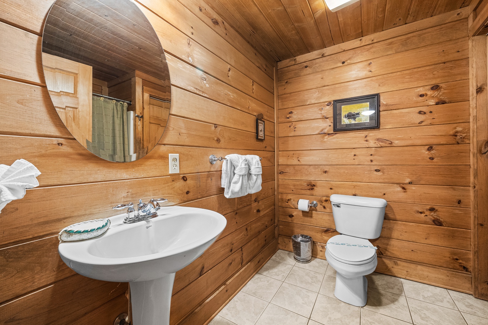 Bathroom with a pedestal sink at A Beary Nice Cabin, a 2 bedroom cabin rental located in Pigeon Forge