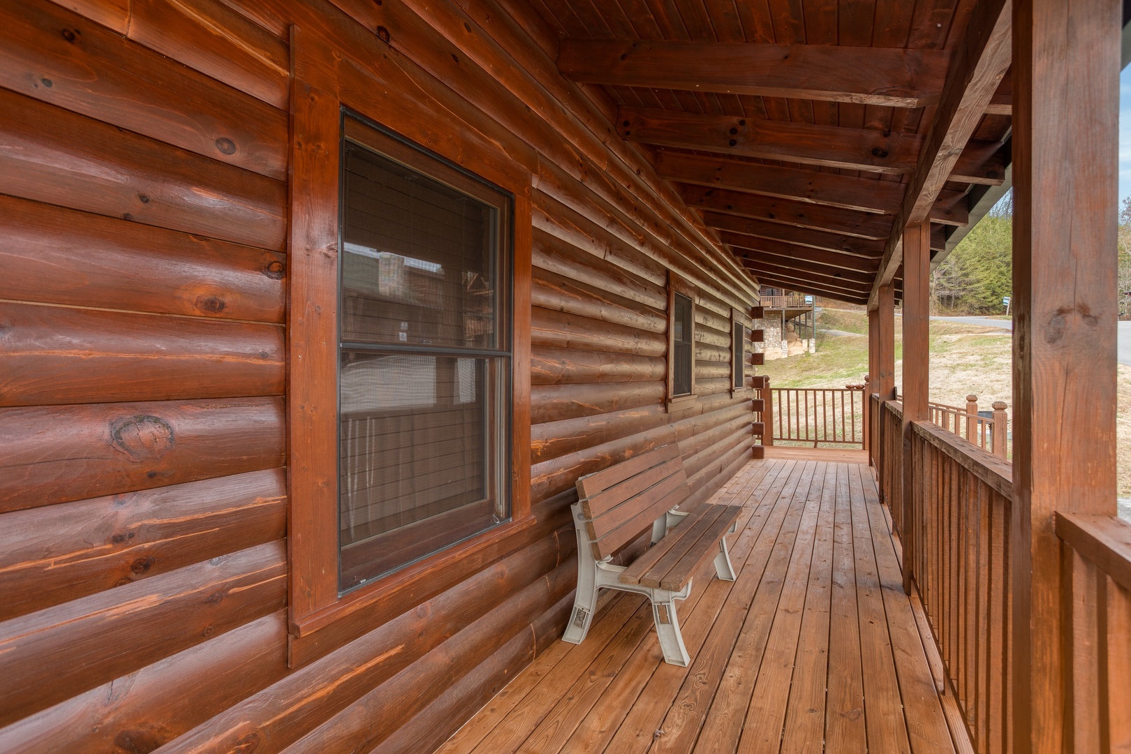Bench on the deck at Hibernation Station, a 3-bedroom cabin rental located in Pigeon Forge