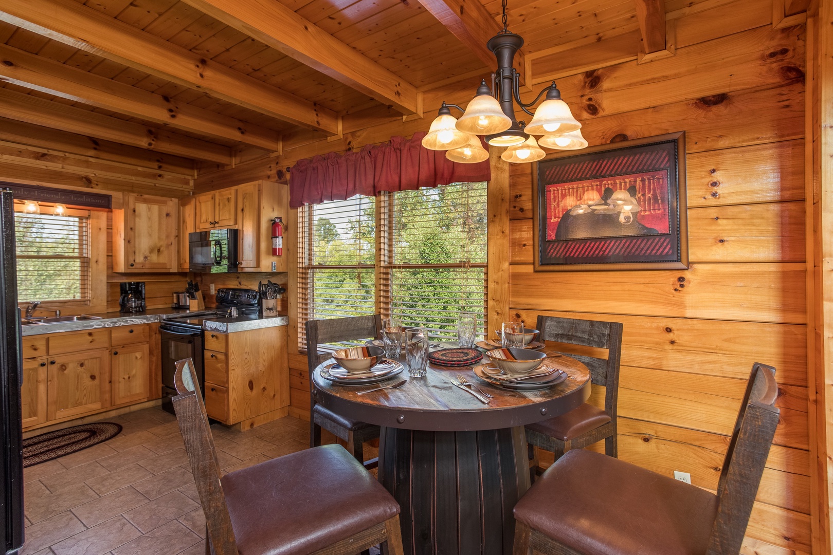 Dining table for 4 in the kitchen at Graceland, a 4-bedroom cabin rental located in Pigeon Forge