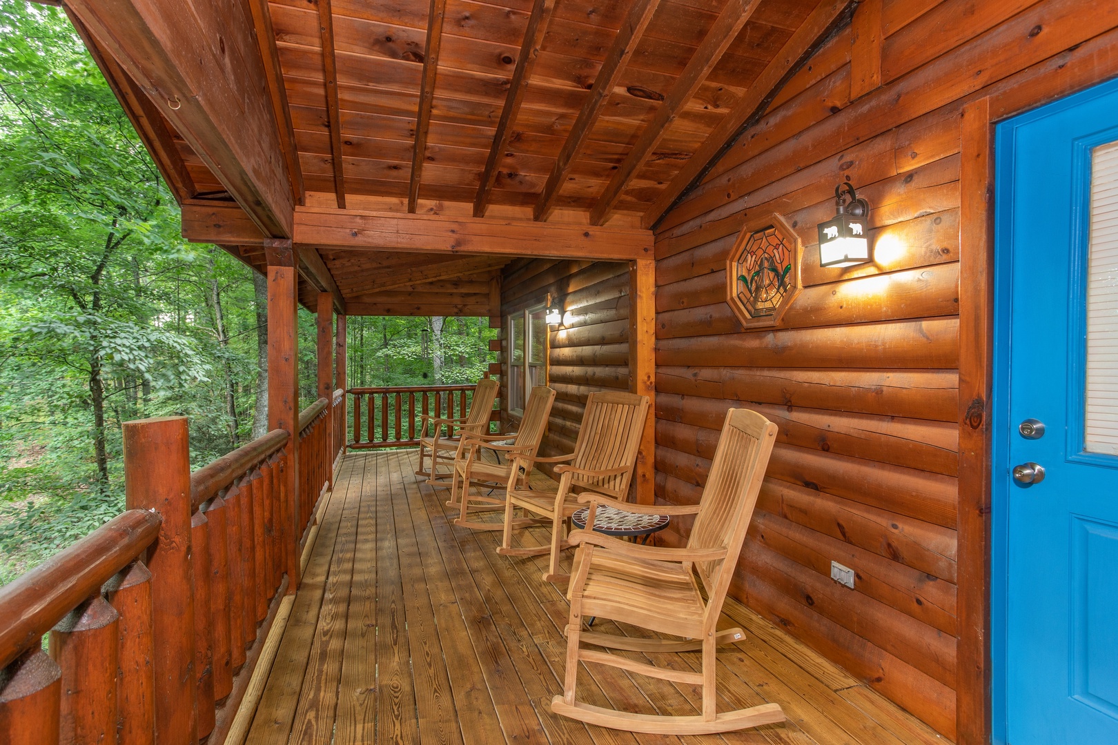 Rocking chairs on the covered deck at Lazy Mountain Retreat, a 1 bedroom cabin rental located in Gatlinburg