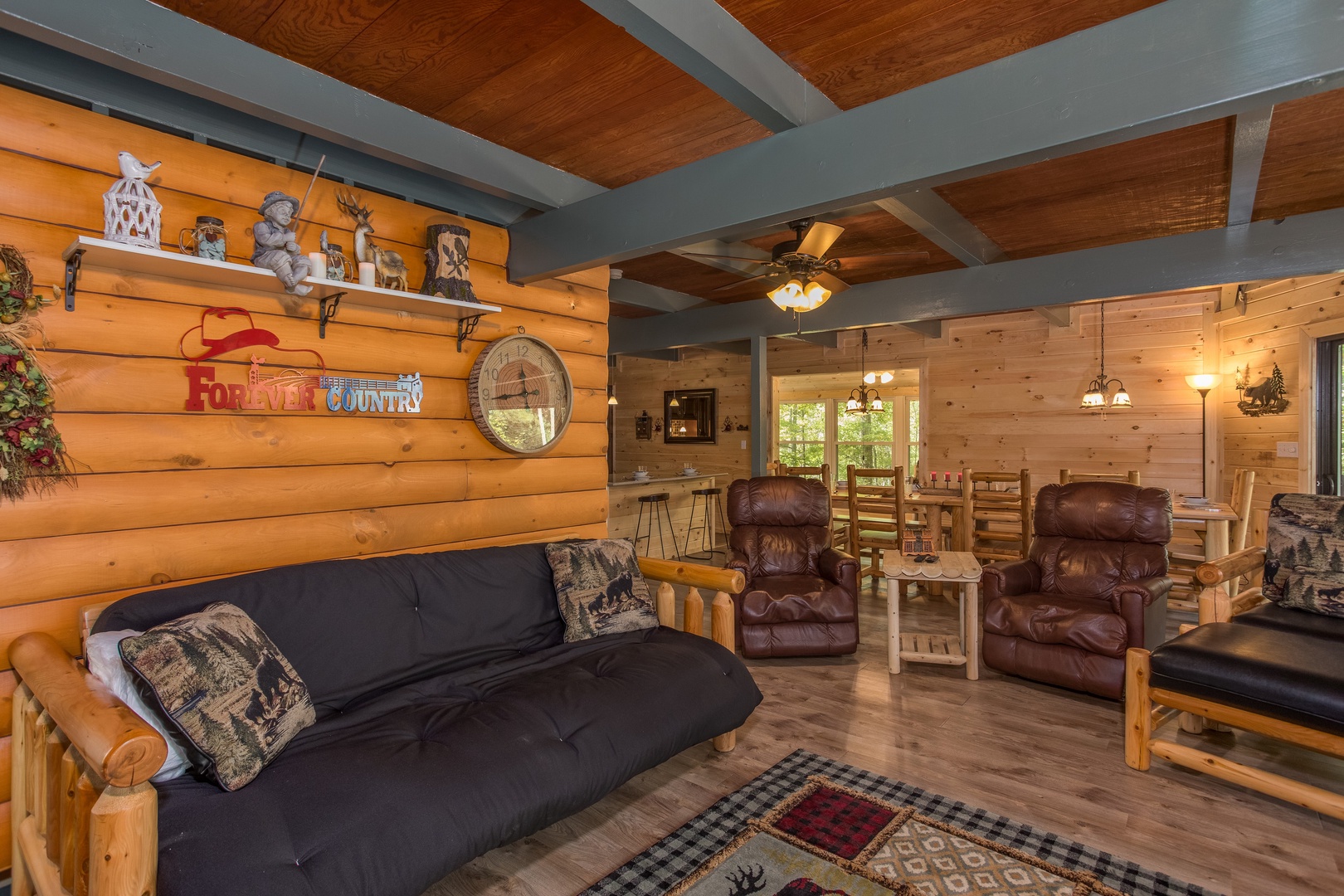 Futon in the living room at Forever Country, a 3 bedroom cabin rental located in Pigeon Forge