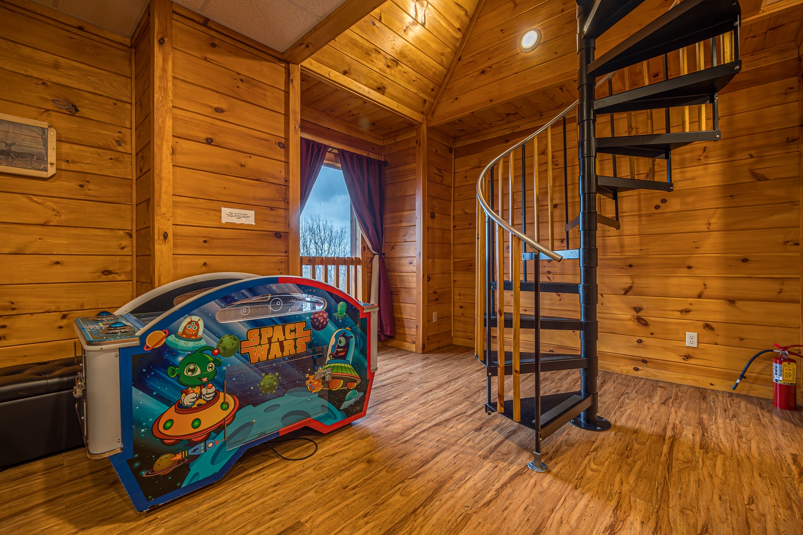 Arcade and staircase at Eagle's Sunrise, a 2 bedroom cabin rental located in Pigeon Forge