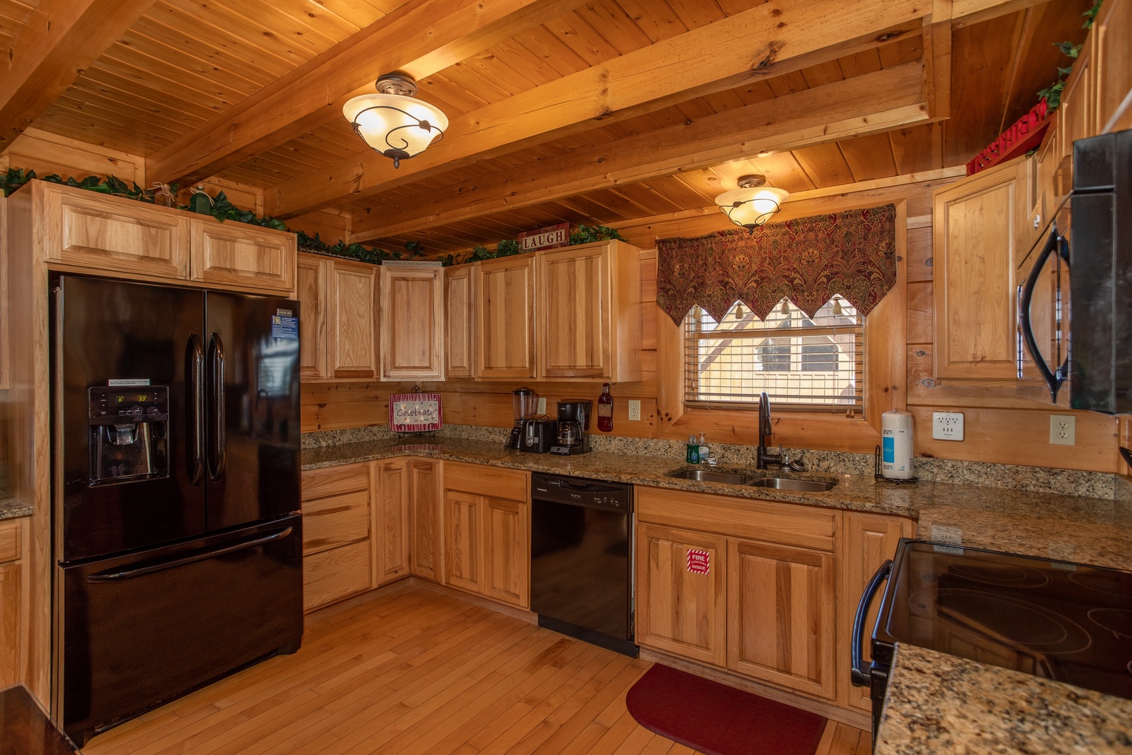 Kitchen with black appliances at Better View, a 4 bedroom cabin rental located in Pigeon Forge