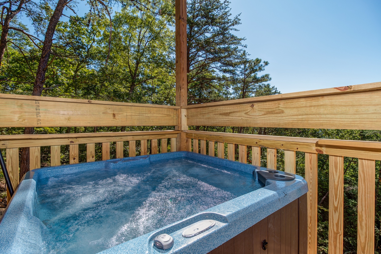 Hot tub on the deck at Canyon Camp Falls, a 2 bedroom cabin rental located in Pigeon Forge