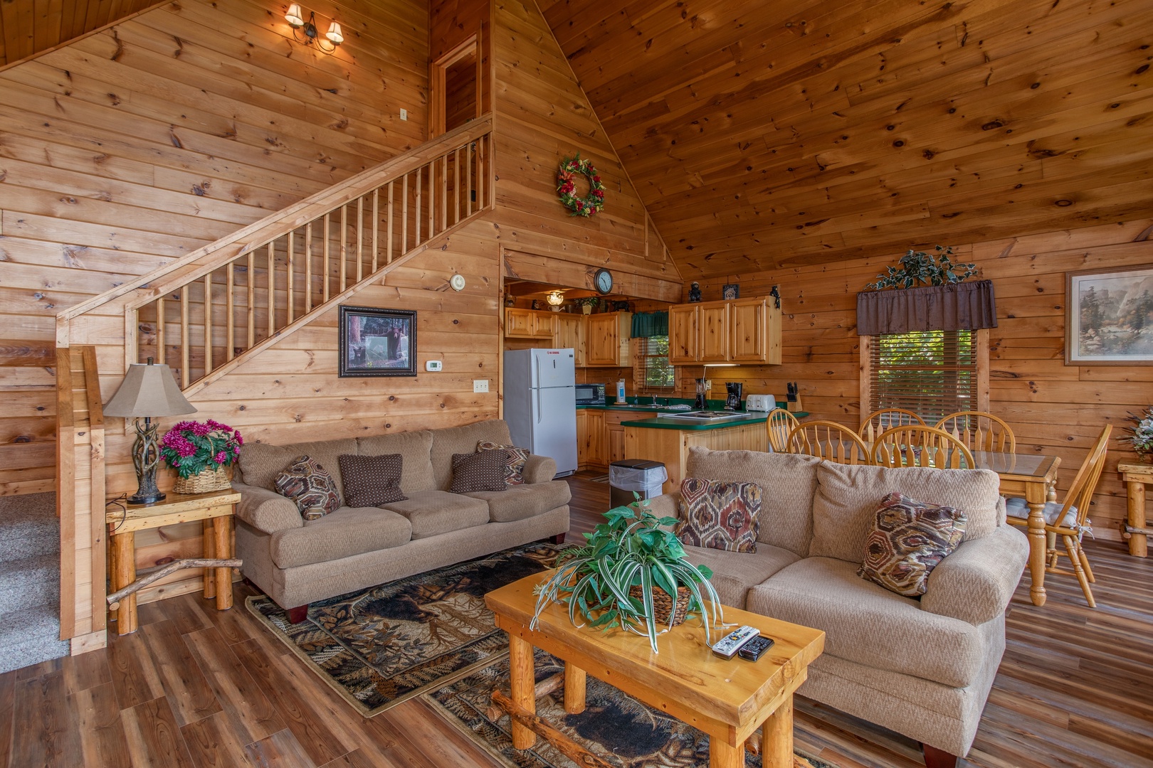 living room with sofa and love seat at angel's majestic view a 3 bedroom cabin rental located in pigeon forge
