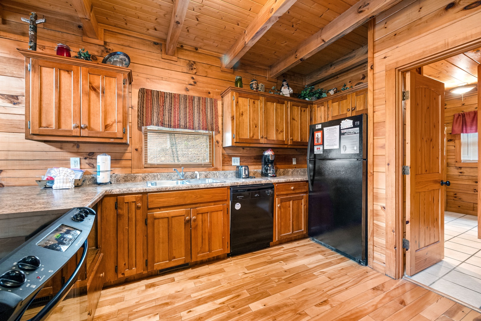 Kitchen with black appliances at Alpine Sondance, a 2 bedroom cabin rental located in Pigeon Forge