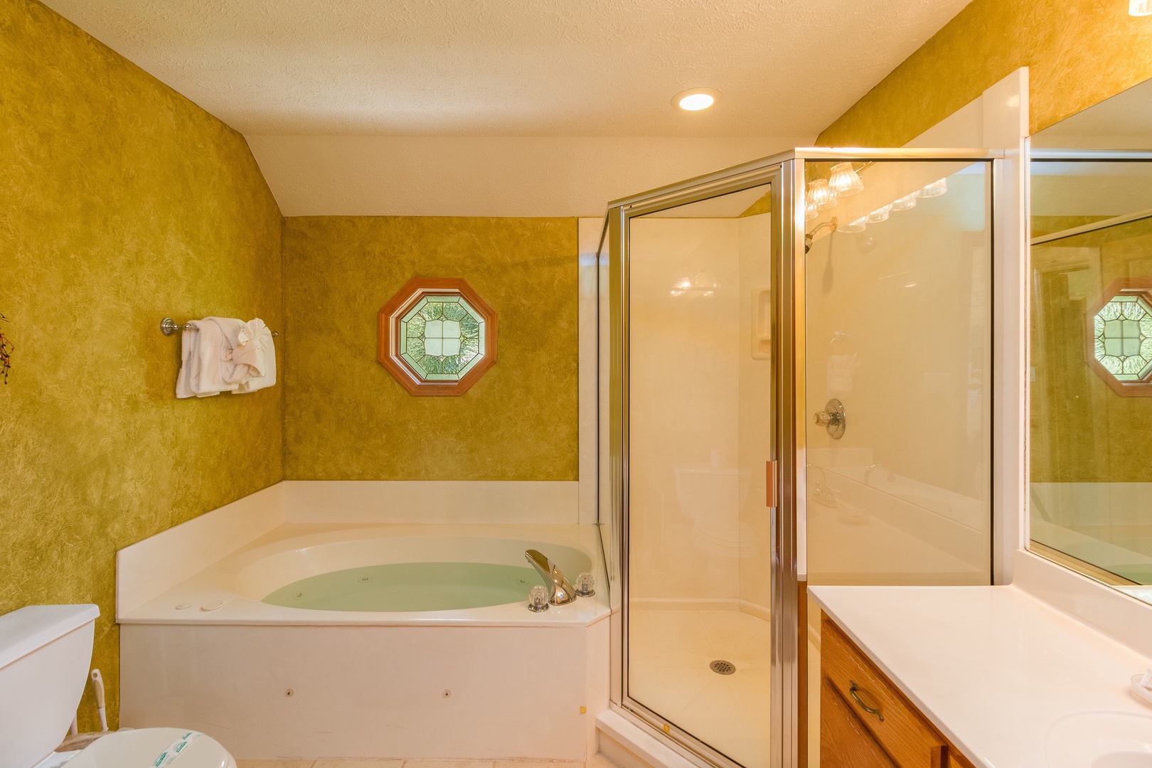 Bathroom with a jacuzzi and separate shower at Stones Throw, a 4 bedroom cabin rental located in Pigeon Forge