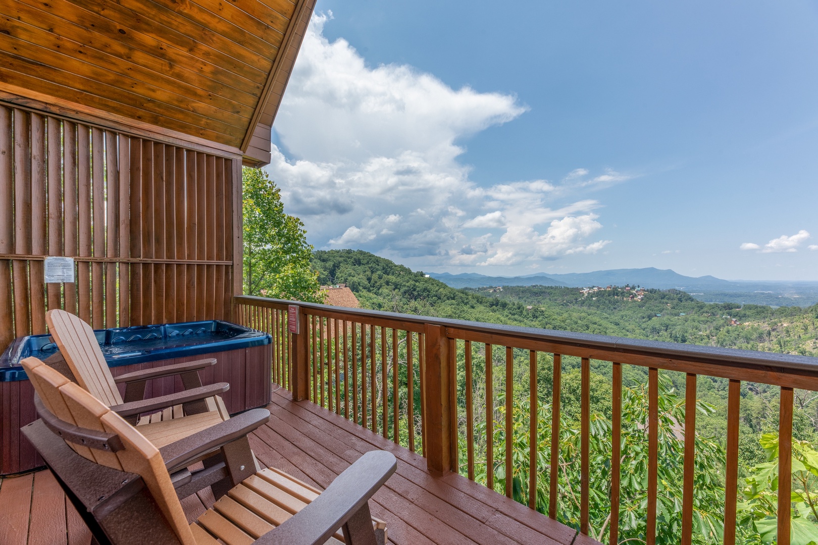 Adirondack chairs, a hot tub, and mountain view at Away From it All, a 1 bedroom cabin rental located in Pigeon Forge