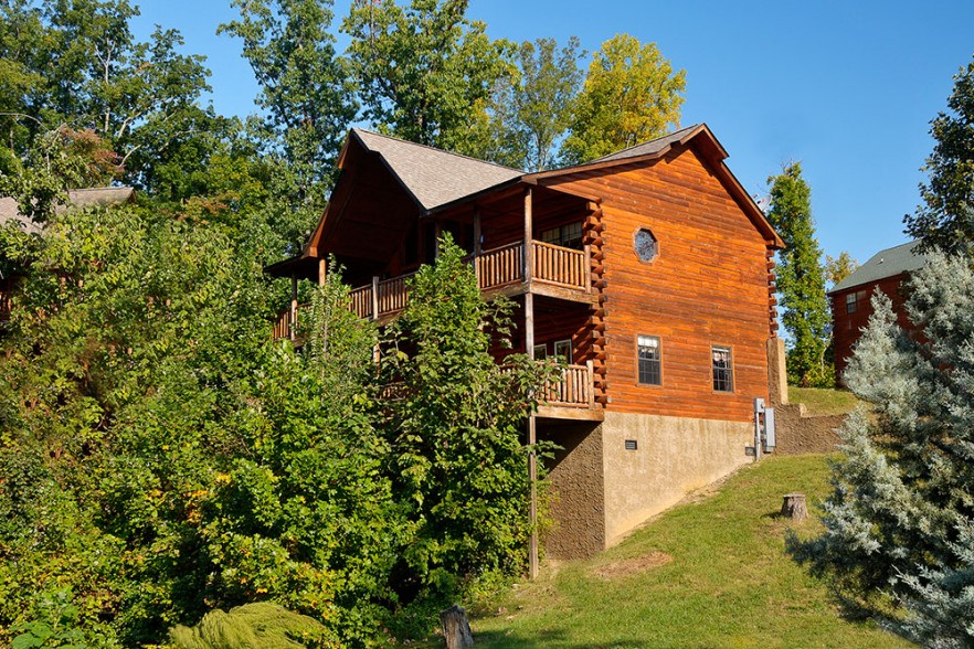 Looking back at the cabin with the trees in front at Kick Back & Relax! A 4 bedroom cabin rental located in Pigeon Forge
