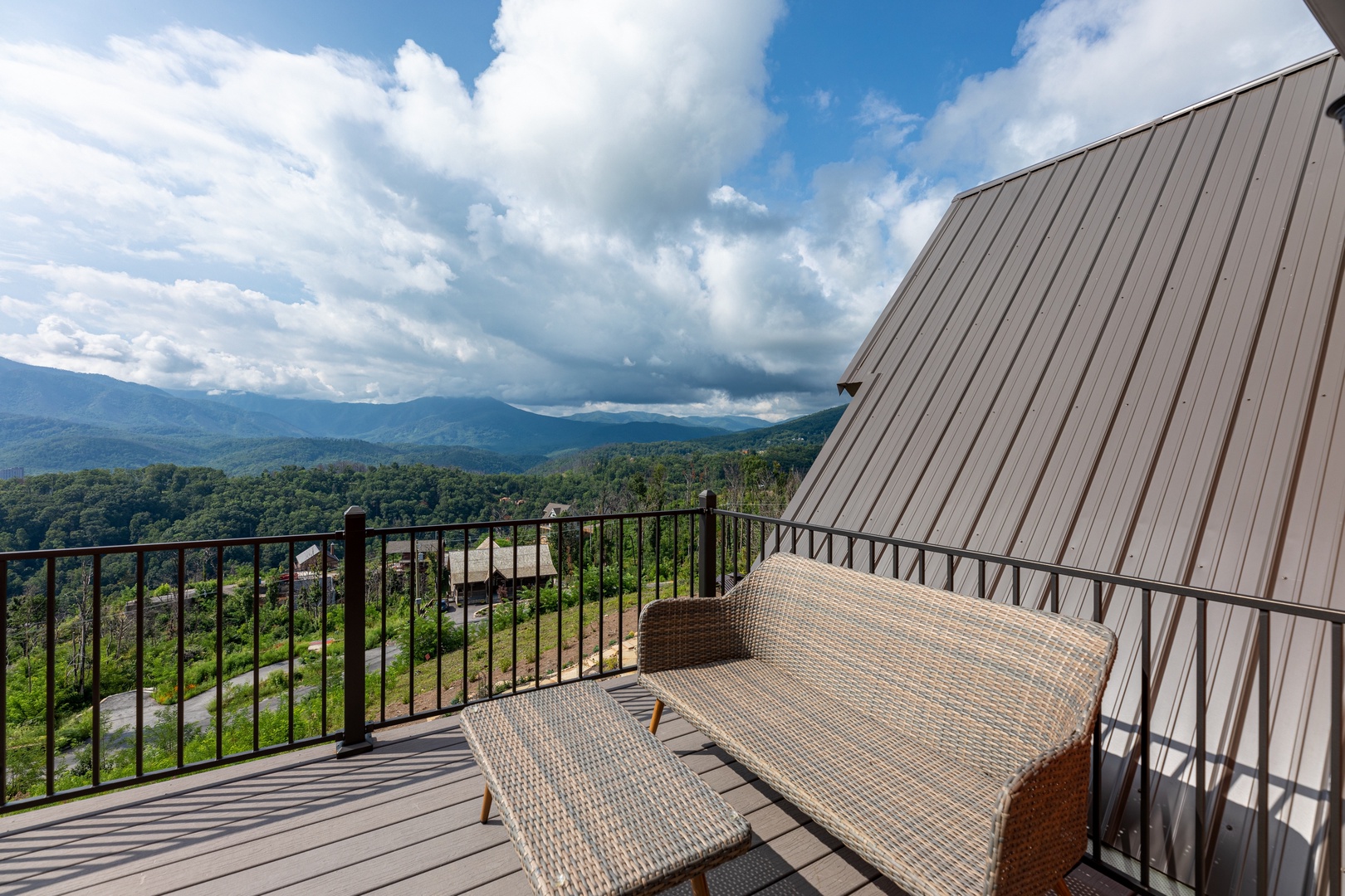Seating on the upper deck at Mountain Celebration, a 4 bedroom cabin rental located in Gatlinburg