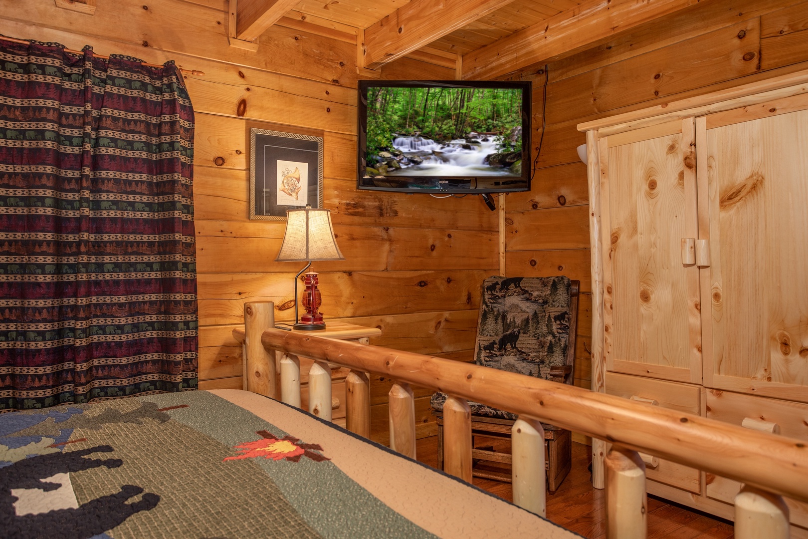 Armoire and TV in a bedroom at Mountain Music, a 5 bedroom cabin rental located in Pigeon Forge