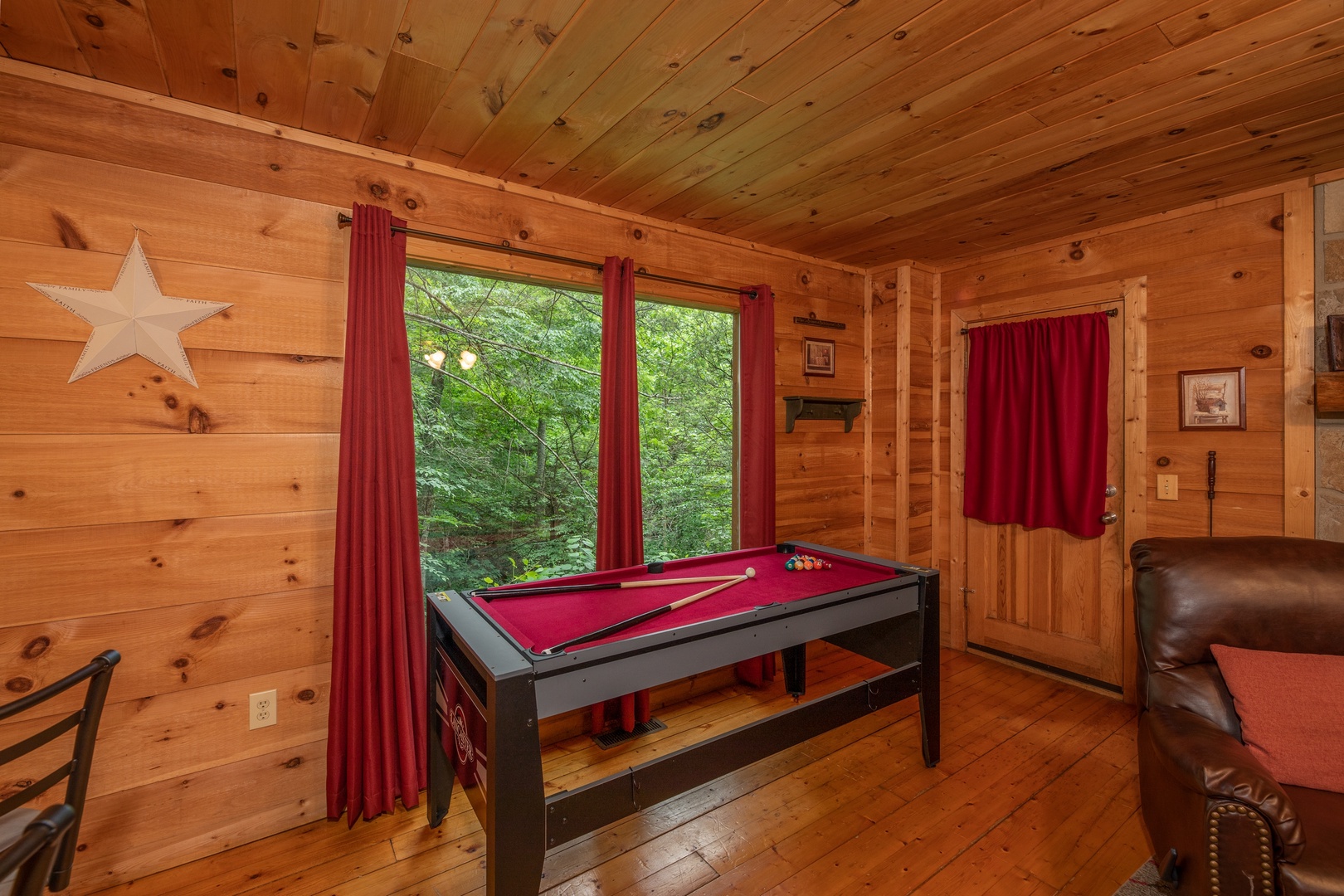 Pool table at Logan's Smoky Den, a 2 bedroom cabin rental located in Pigeon Forge