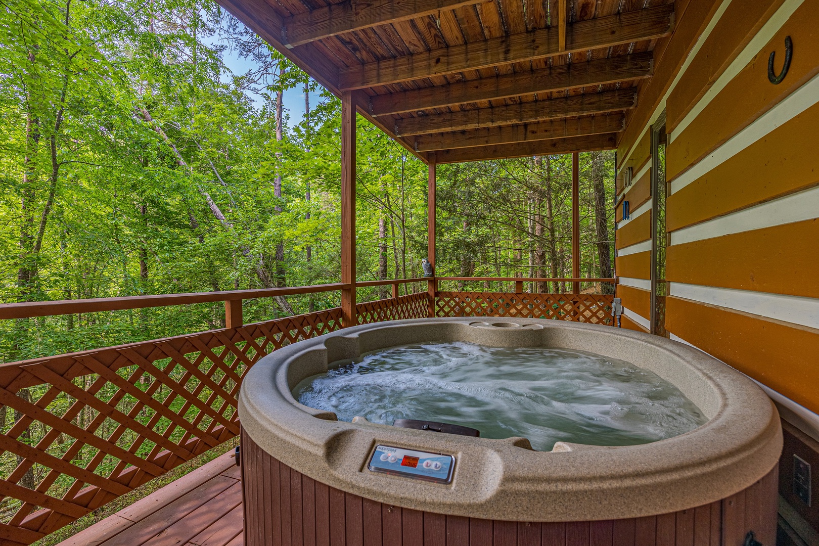 Bubbling hot tub at Copper Owl, a 2 bedroom cabin rental located in Pigeon Forge