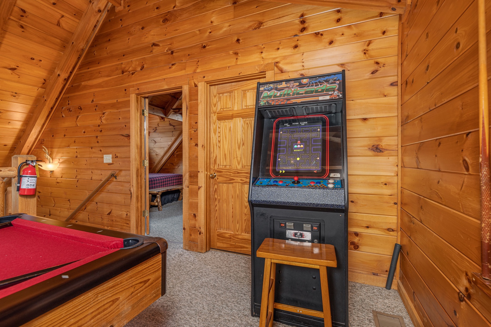 Arcade game in the loft at Livin' Simple, a 2 bedroom cabin rental located in Pigeon Forge