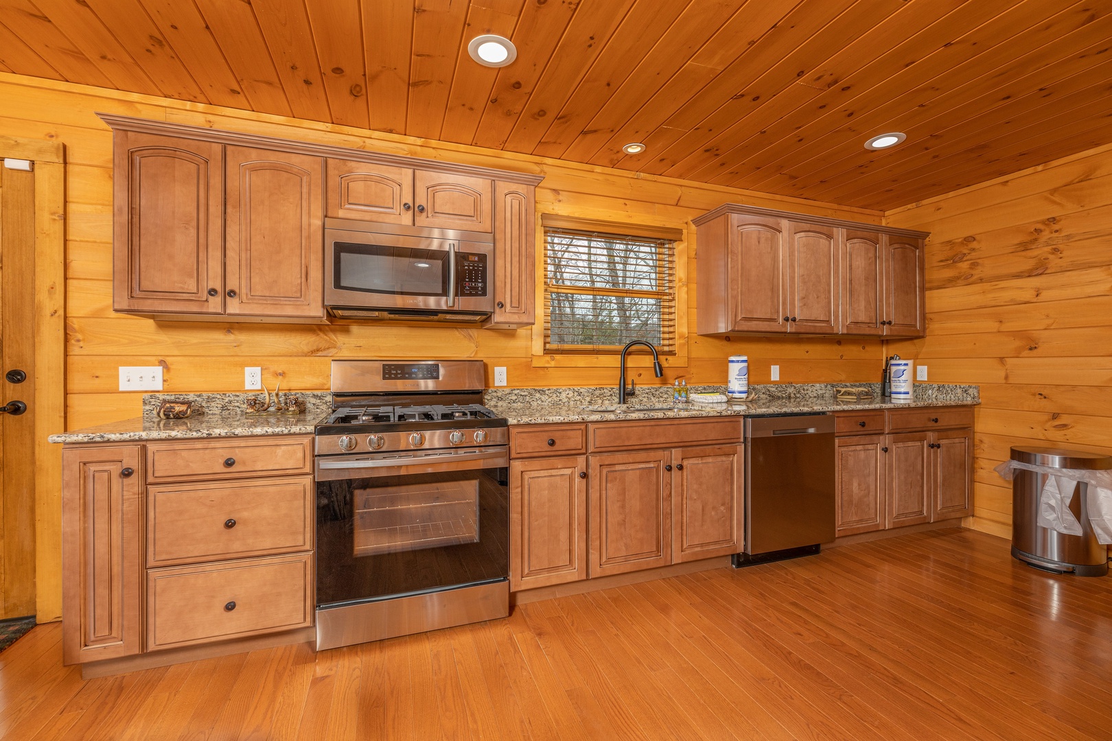 Kitchen with stainless appliances and granite counters at J's Hideaway, a 4 bedroom cabin rental located in Pigeon Forge