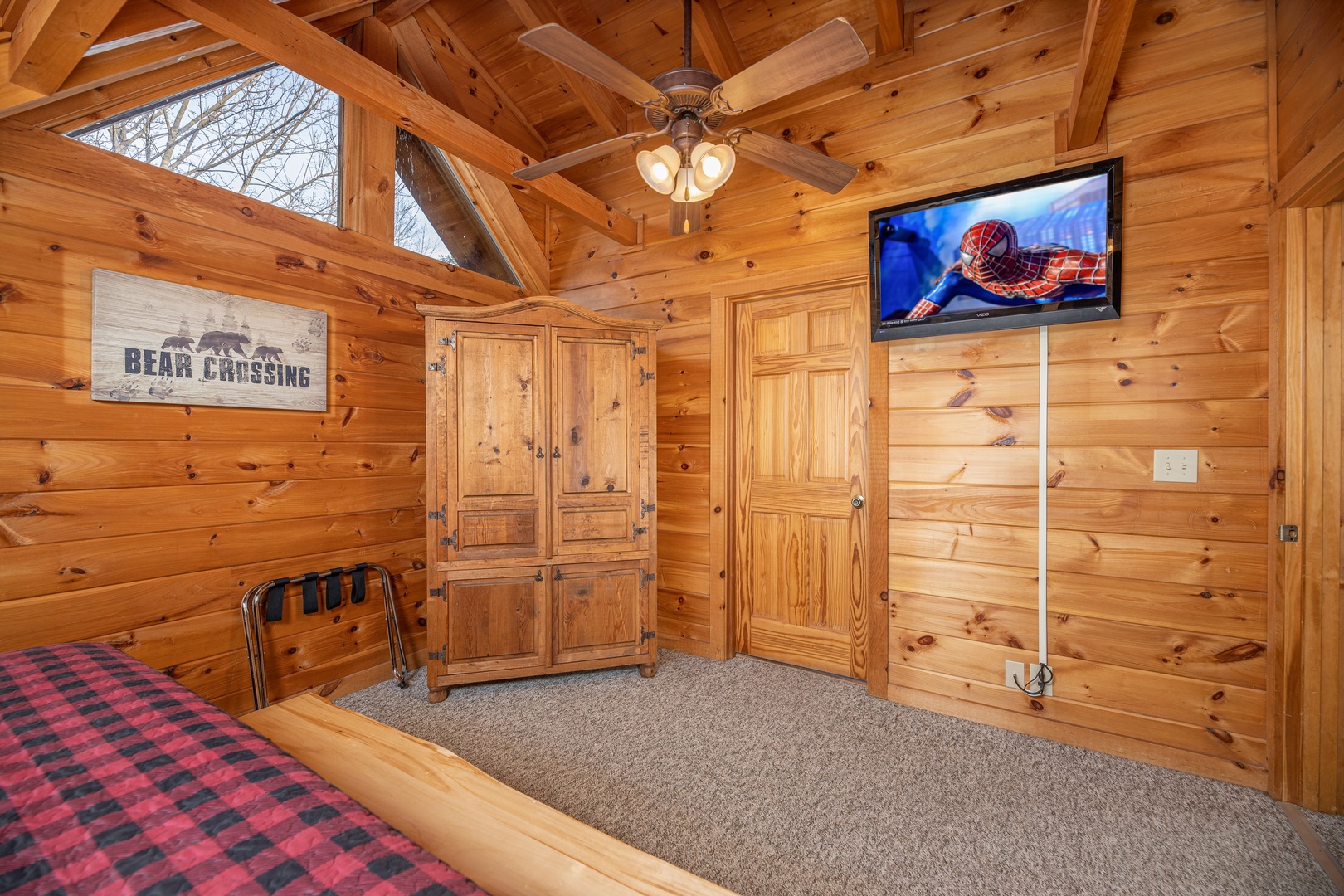 Armoire & TV in a bedroom at Livin' Simple, a 2 bedroom cabin rental located in Pigeon Forge