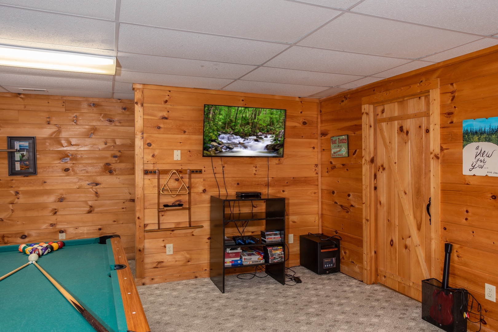 Television in the game room at A View for You, a 1 bedroom cabin rental located in Pigeon Forge