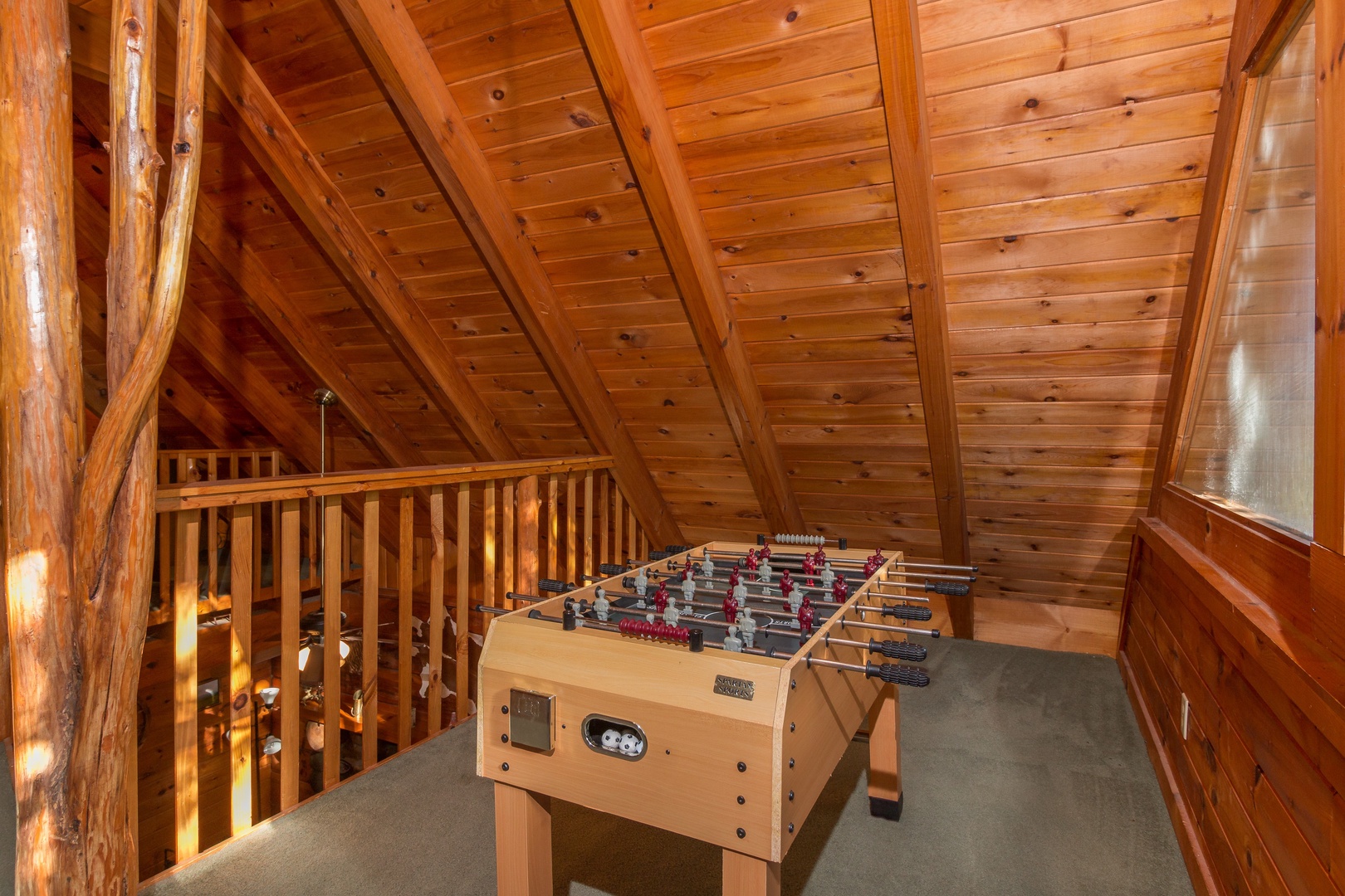 Foosball table in the loft at Hawk's Nest, a 1 bedroom cabin rental located in Pigeon Forge