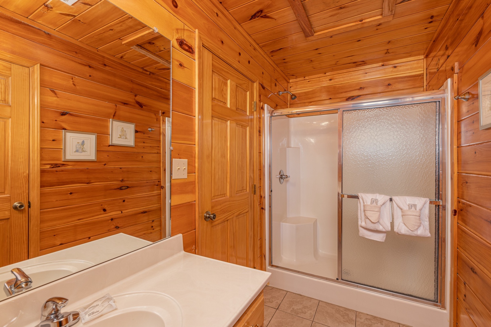 Bathroom with a shower at Hickernut Lodge, a 5-bedroom cabin rental located in Pigeon Forge
