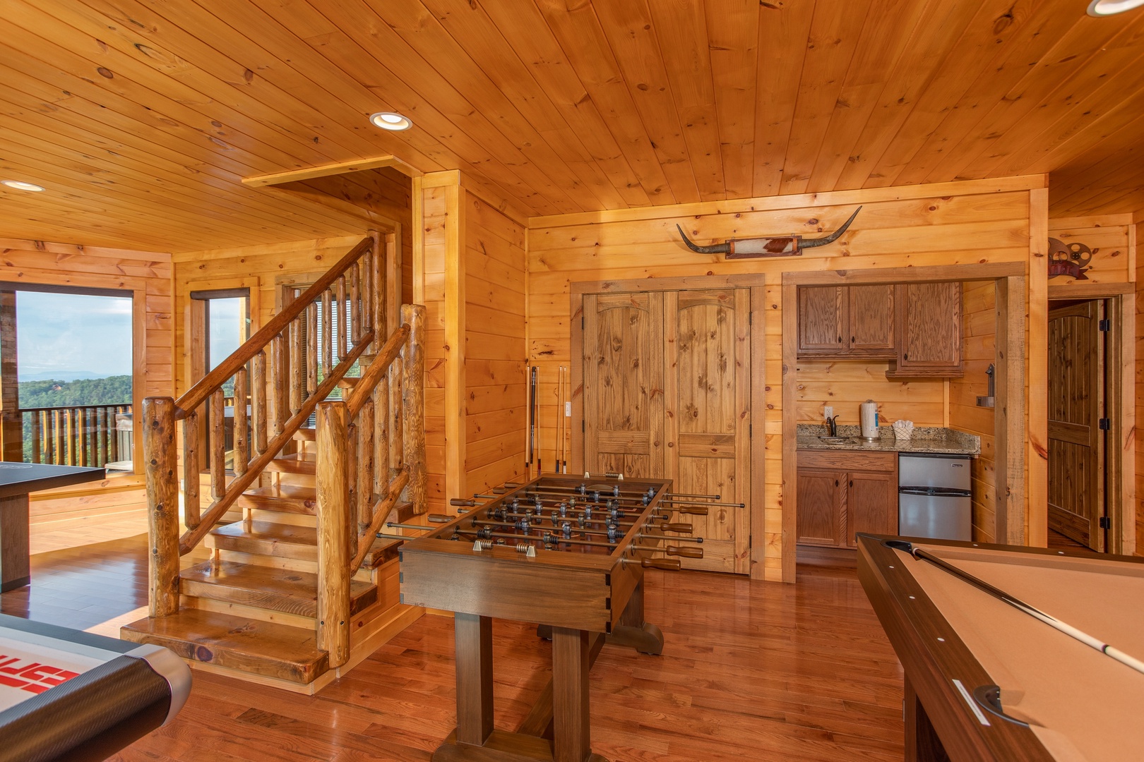 Foosball table in the game room at Four Seasons Palace, a 5-bedroom cabin rental located in Pigeon Forge