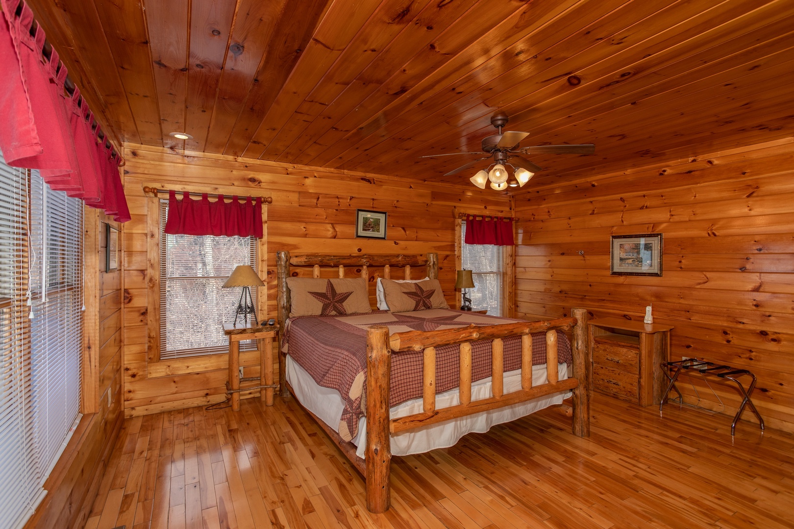 Bedroom with a log bed, dresser, and suitcase stand at 5 Star View, a 3 bedroom cabin rental located in Gatlinburg