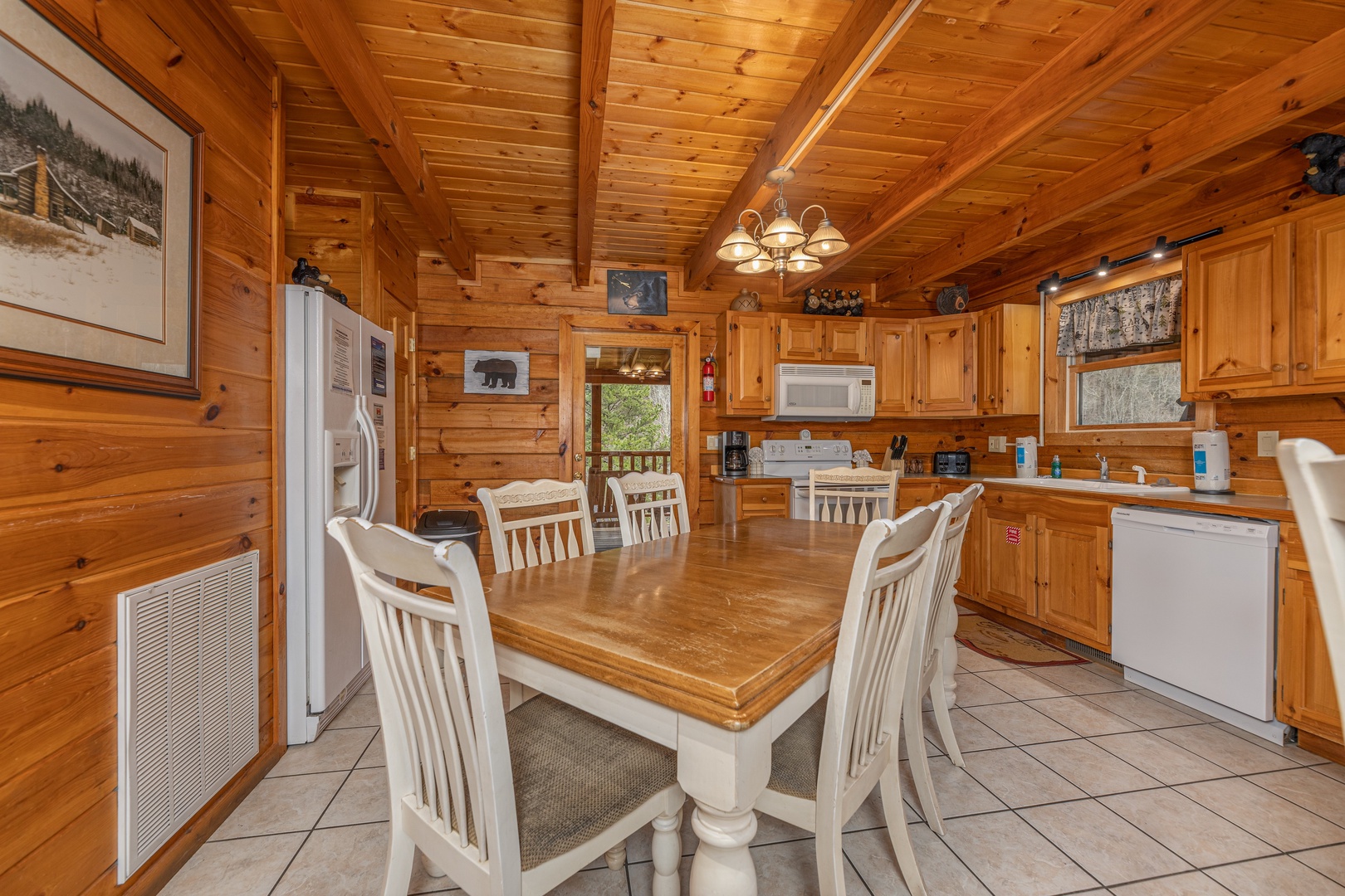 Dining table for six in the kitchen at Almost Bearadise, a 4 bedroom cabin rental located in Pigeon Forge