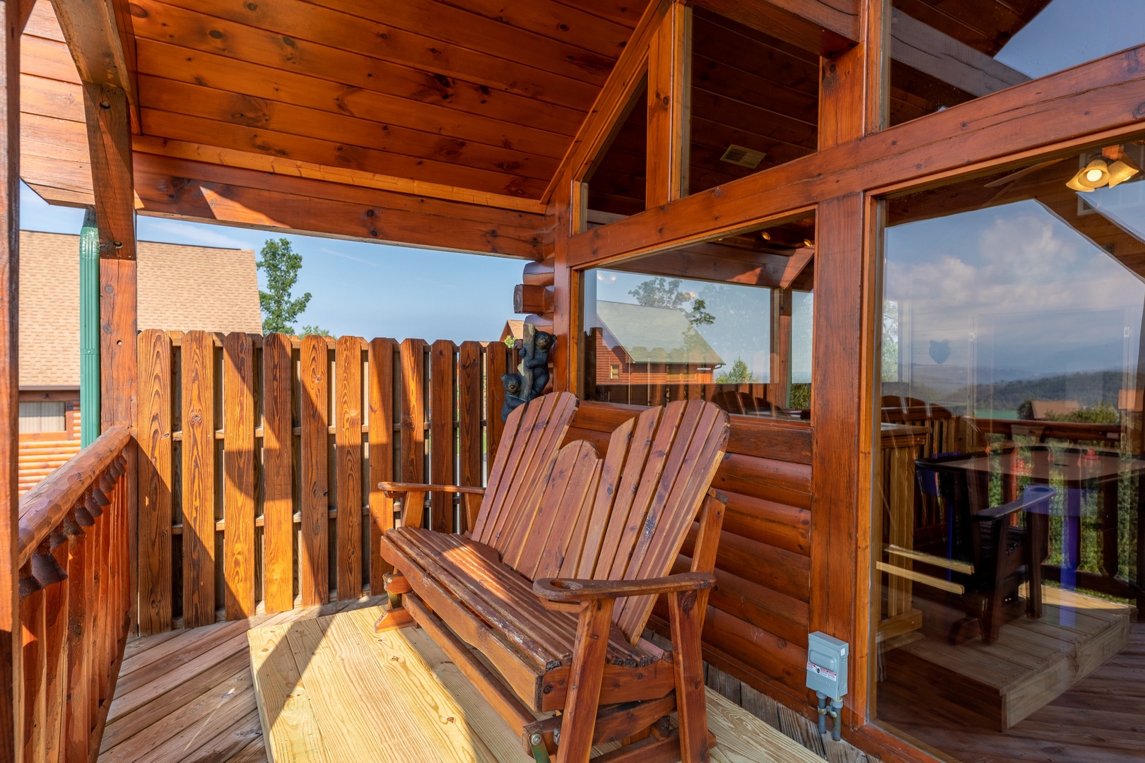 Adirondack bench on the loft deck at 1 Above the Smokies, a 2 bedroom cabin rental located in Pigeon Forge