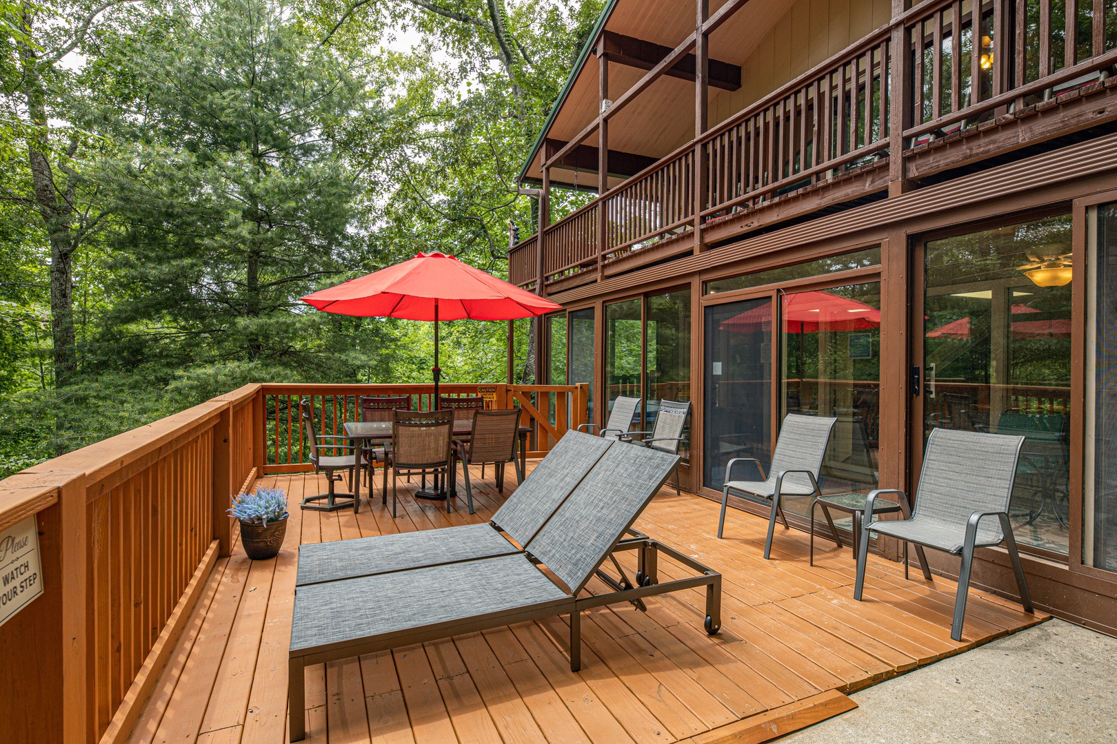 Lounging chairs and exterior side view at Buena Vista Getaway, 3 bedroom cabin rental located in Gatlinburg