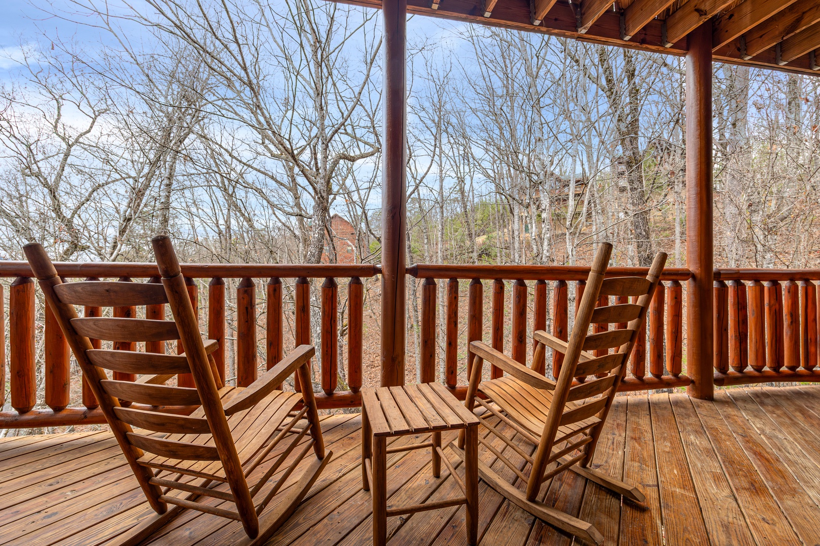 Rocking chairs for two and end table at Family Ties Lodge