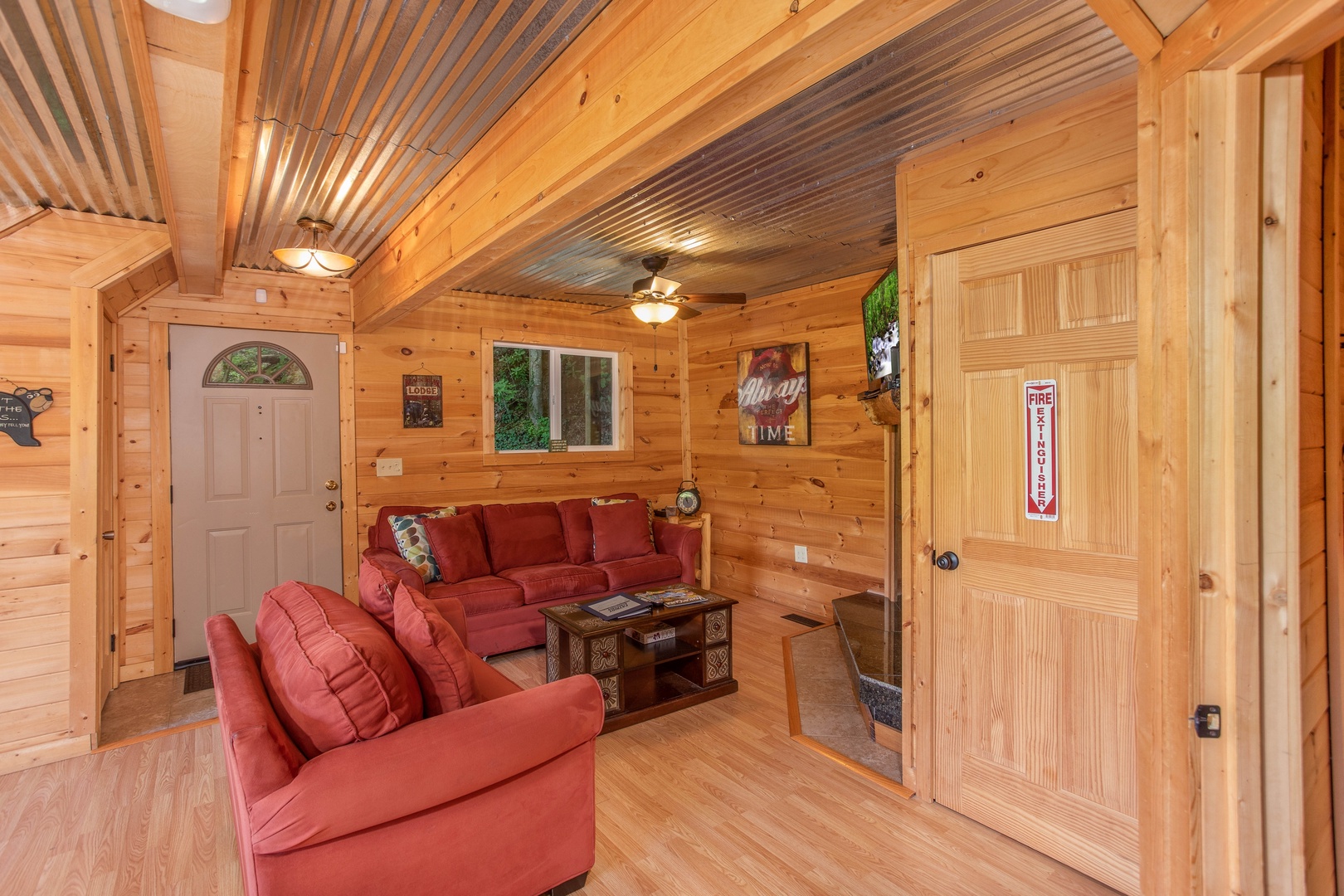Sofa and loveseat in the living room at License to Chill, a 3 bedroom cabin rental located in Gatlinburg