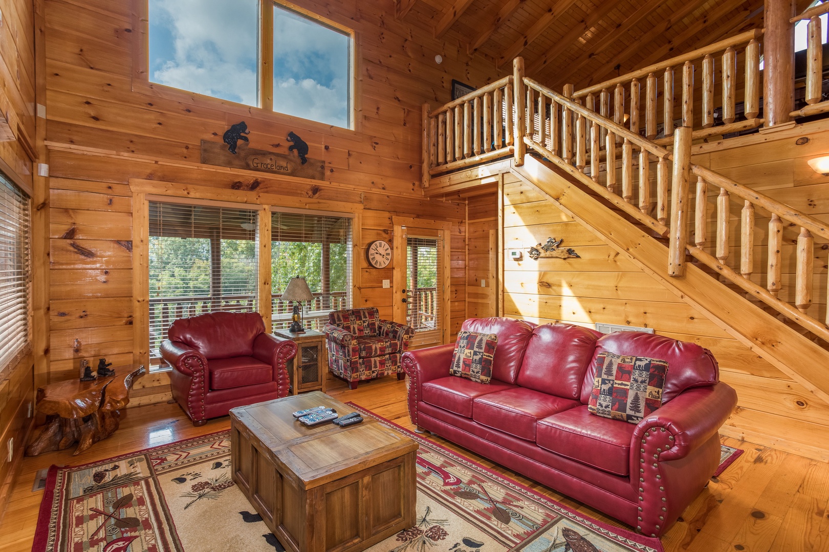 Sofa and two chairs in a living room at Graceland, a 4-bedroom cabin rental located in Pigeon Forge