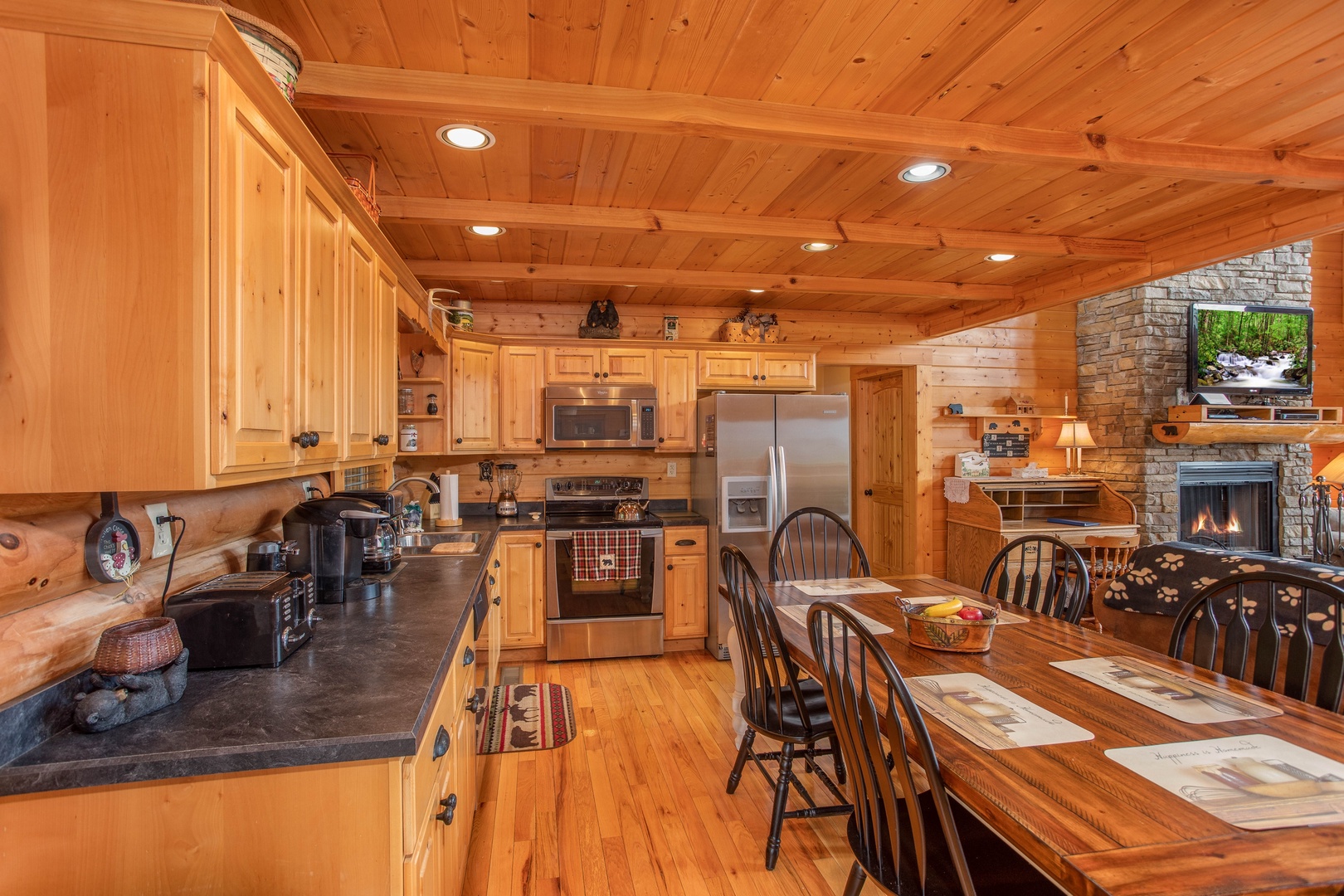 Kitchen with stainless steel appliances and dining space for six at I Do Love Views, a 3 bedroom cabin rental located in Pigeon Forge