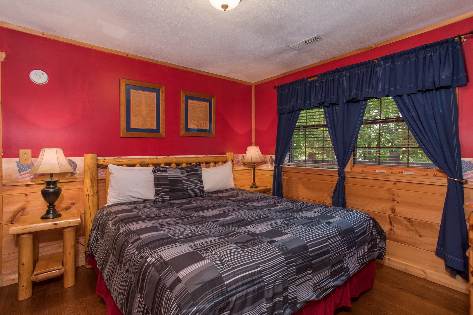 Bedroom with a king bed at Patriot Pointe, a 5 bedroom cabin rental located in Pigeon Forge
