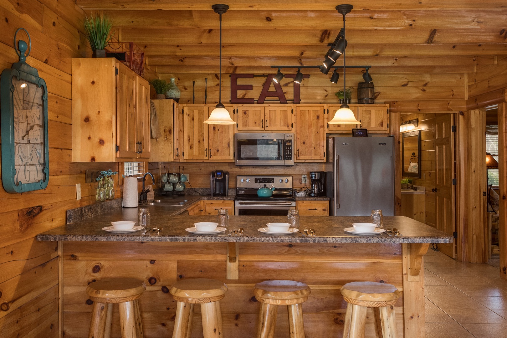 Counter seating for four off the kitchen at Mountain View Meadows, a 3 bedroom cabin rental located in Pigeon Forge