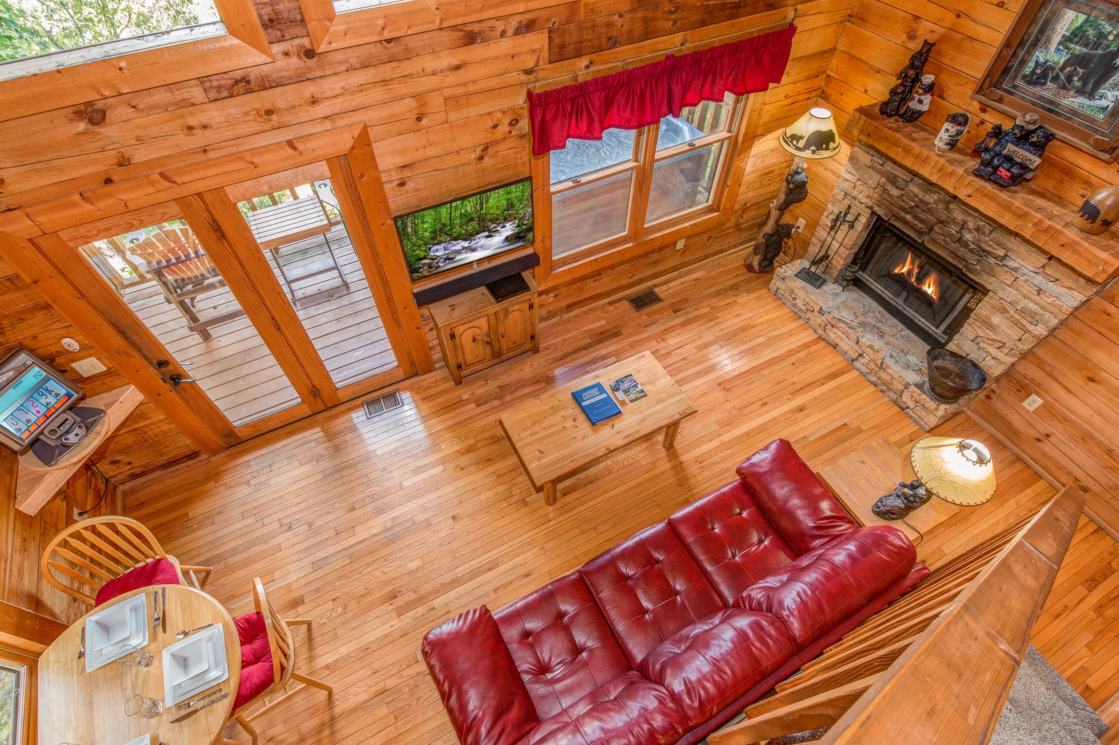 Looking down at the living room at Cupid's Crossing, a 1 bedroom cabin rental located in Pigeon Forge