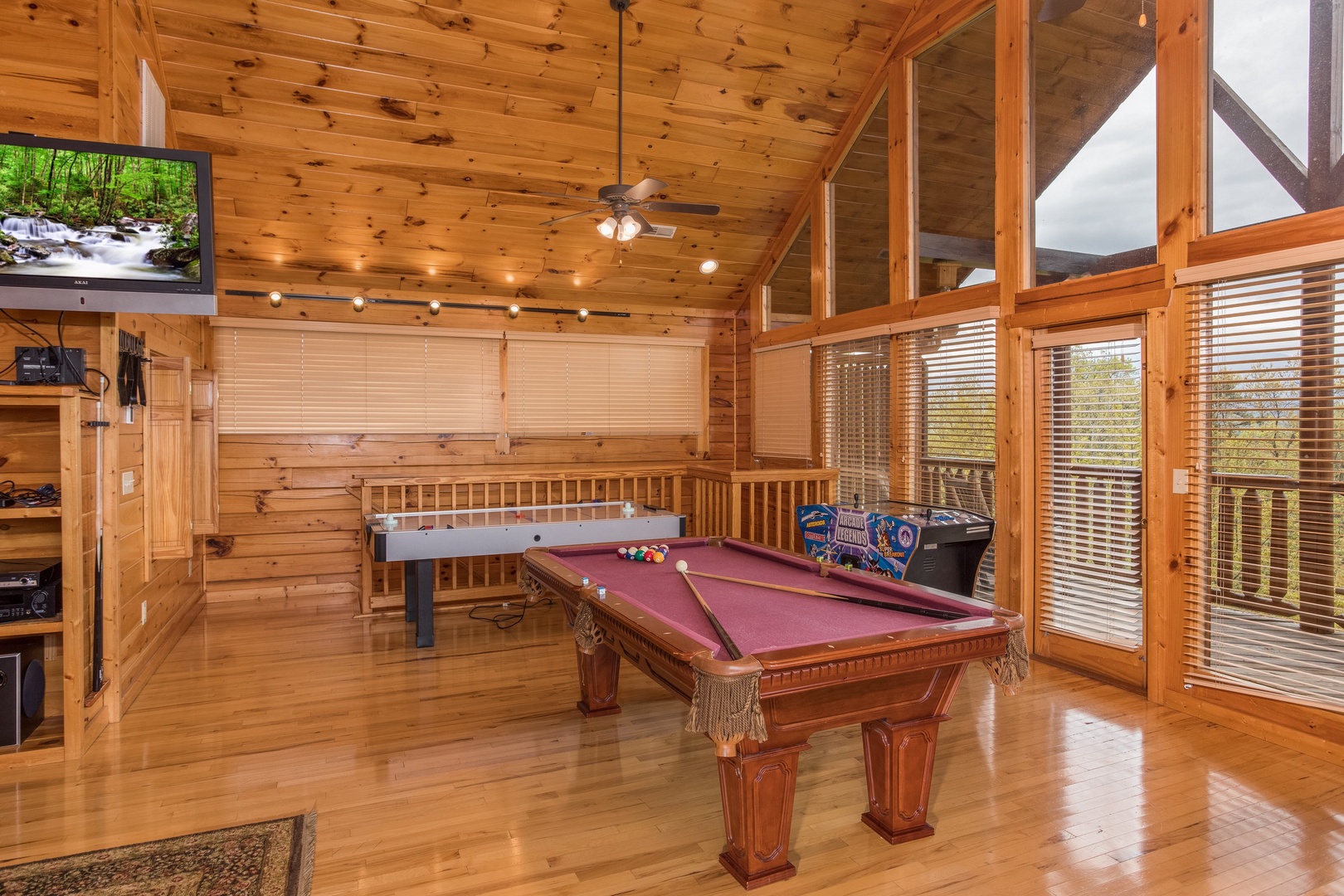 Pool table in the loft space at Howlin' in the Smokies, a 2 bedroom cabin rental located in Pigeon Forge